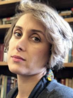 Headshot Of Professor Fatemah Shams In Front Of A Bookcase