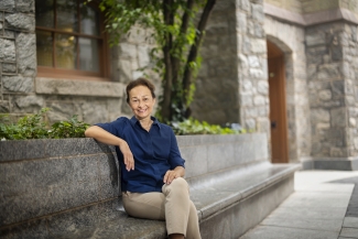 Feride Hatiboglu Sits On A Bench Outside Of Williams Hall