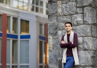 Zaid Tabaza Leaning Against A Wall Outside Of Williams Hall